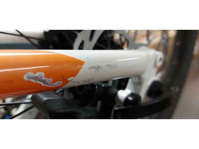 Damski rower elektryczny CTM RUBY 29 w kolorze biało-pomarańczowym